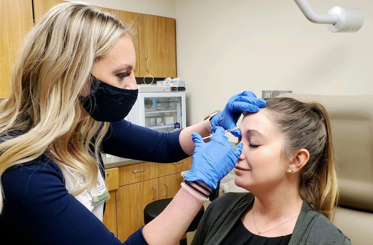 woman getting botox injection on face